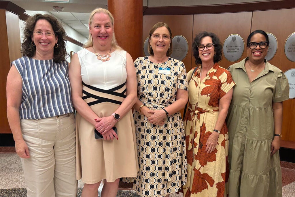 Five GWIM board members stand together